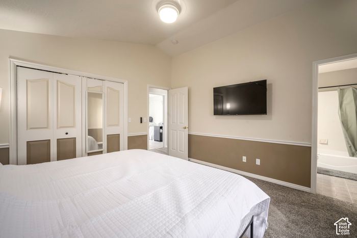 Primary bedroom with a doorway to its own bathroom
